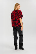 Top Palmer in red abstract