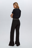 Black ruffle trousers