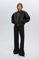Black ruffle trousers